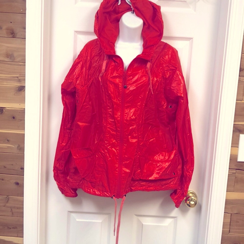 Athlete size large light weight red jacket. Like new. Worn once